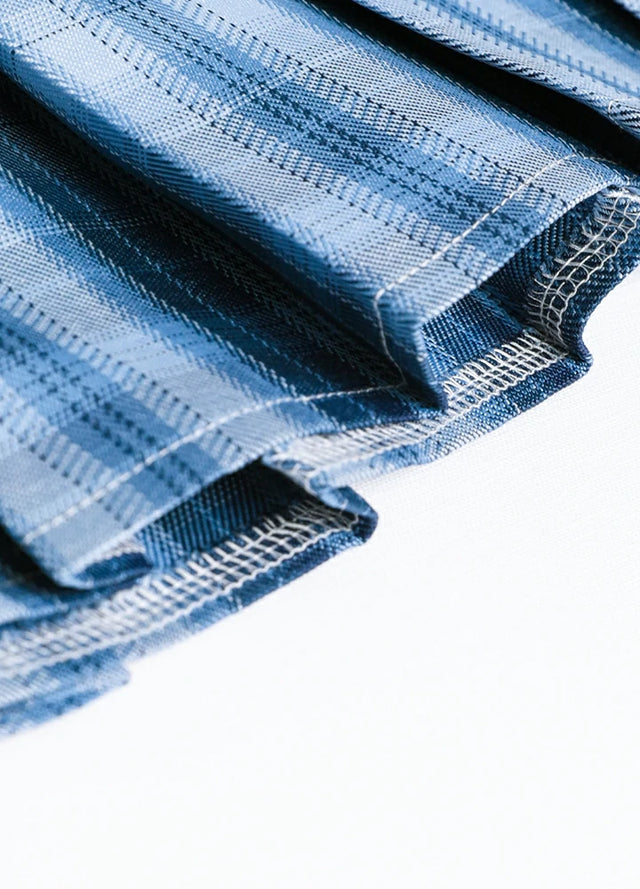 Detailed view of womens built-in elastic shorts blue plaid mini pleated skirt hem