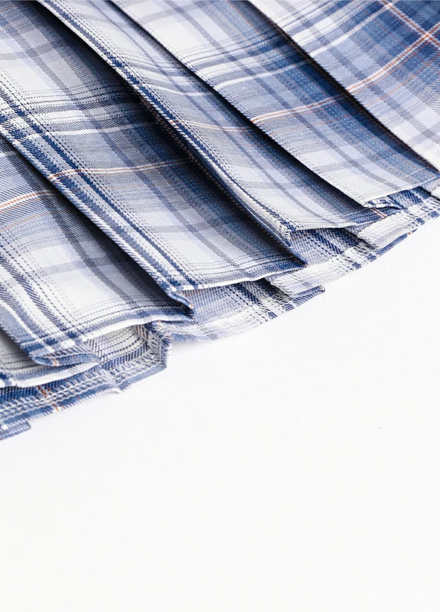 Detailed view of womens built-in elastic shorts white blue plaid mini pleated skirt hem