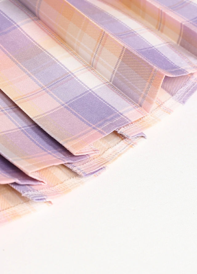 Detailed view of womens built-in elastic shorts pink blue plaid mini pleated skirt hem