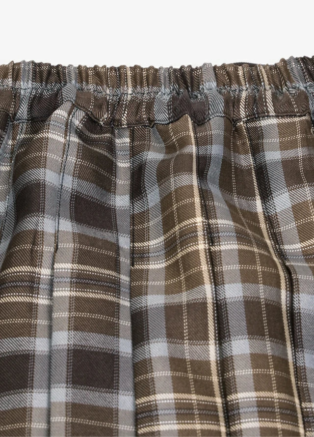 Detailed view of womens side button plaid mini pleated skirt elastic waist