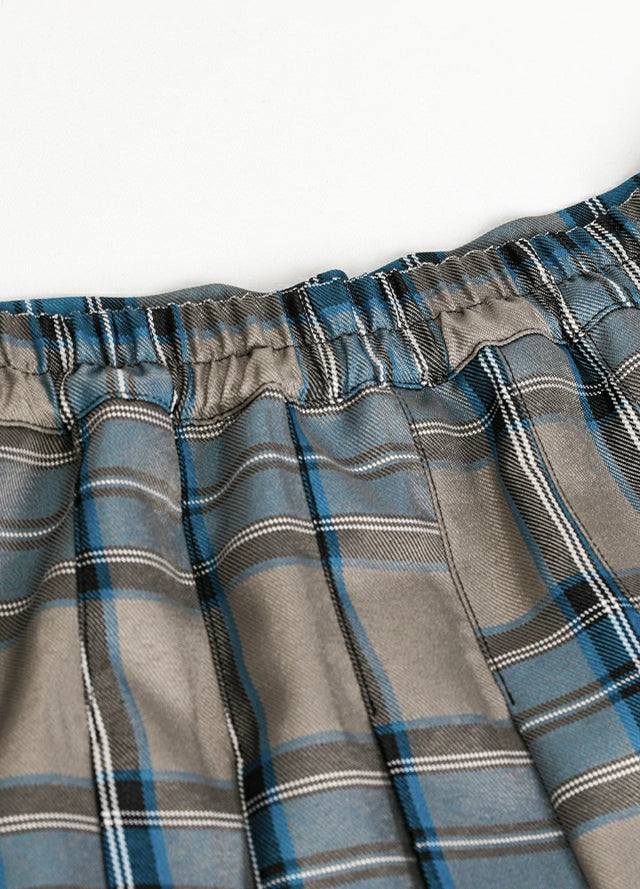 Detailed view of womens side button blue gray plaid mini pleated skirt elastic waist
