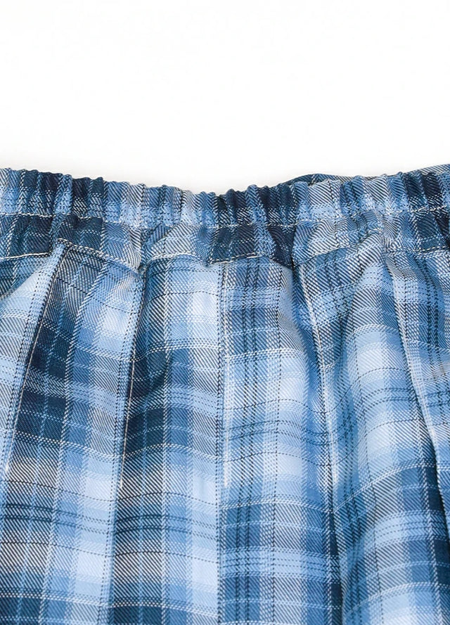 Detailed view of womens side button blue plaid mini pleated skirt elastic waist