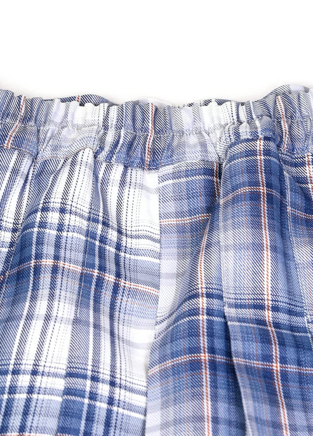 Detailed view of womens side button blue white plaid mini pleated skirt elastic waist