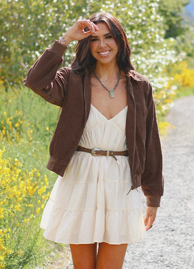 Women in a vintage brown full zip corduroy jacket with flannel lining