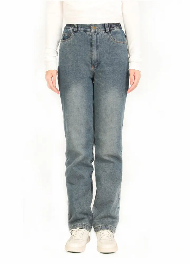 Front view of a woman wearing blue flannel-lined straight-leg jeans