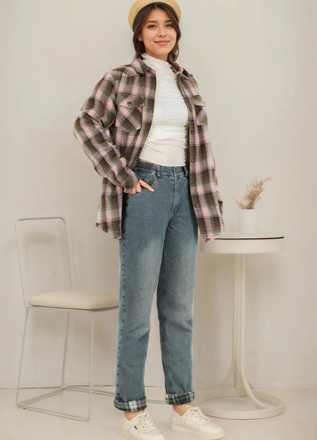 Profile shot of a woman in blue flannel-lined jeans