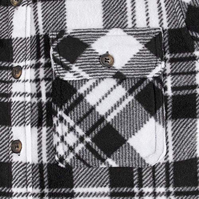 Close-up of women's black white sherpa lined plaid jacket chest pocket