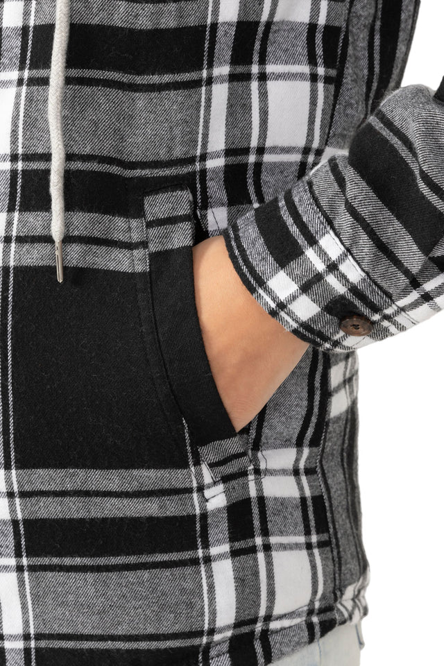 Close-up of womens black white sherpa lined flannel plaid hooded hand pocket