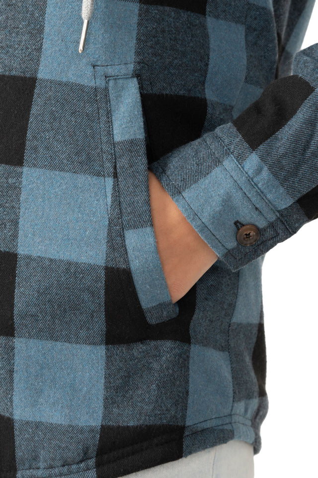 Close-up of womens checkered blue black winter warm plaid jacket hand pocket