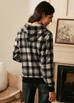 Back view of women in a black sherpa lined hoodie sweatshirt