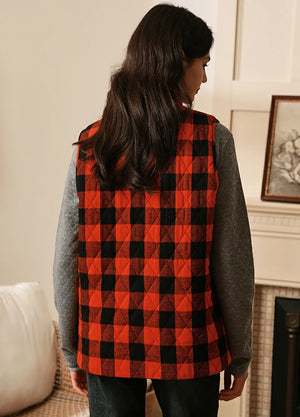 Back view of women in a cozy full zip quilted flannel plaid vest
