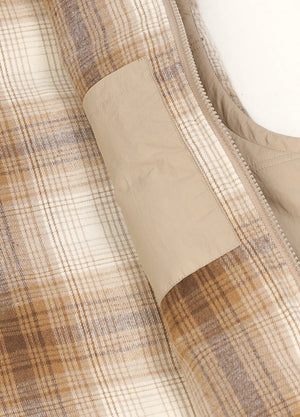 Close-up of women's khaki winter lightweight puffer vest inner pocket