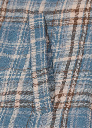 Close-up of womens blue beige sherpa-lined flannel hooded hand pocket