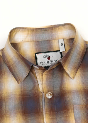 Close-up of womens yellow navy plaid short-sleeves shirt collar