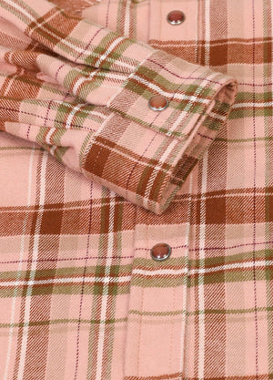 Detailed view of women's pink snap-button soft flannel plaid shirt cuffs
