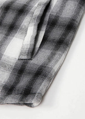Detailed view of womens black white snap button flannel hood hand pocket