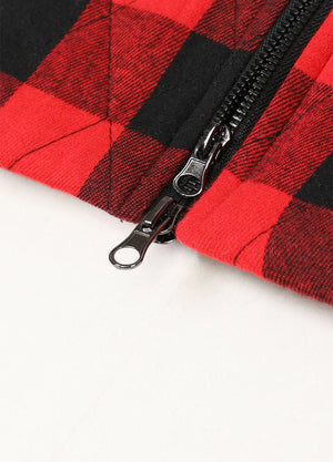 Close-up of womens black and red zip-up quilted plaid flannel vest inside pocket