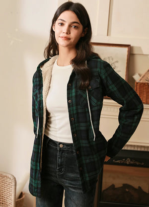 Side view of women in a green and black sherpa lined plaid hooded