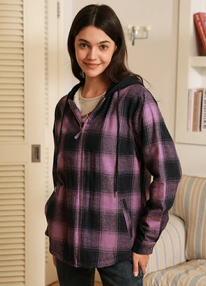 Side view of women in a purple winter zip-up plaid hooded jacket