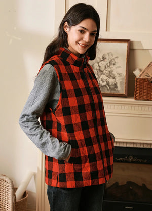 Side view of women in a red and black warm sleeveless plaid vest