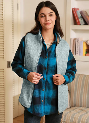 Women in a green gray warm sherpa lined sweater fleece vest