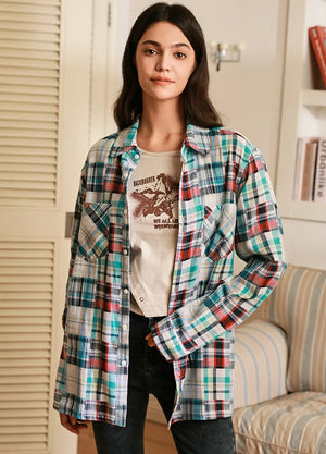 Women in a irregular plaid patchwork style white and blue plaid shirt