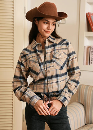 Women in a khaki navy snap flannel plaid shirt with chest pocket