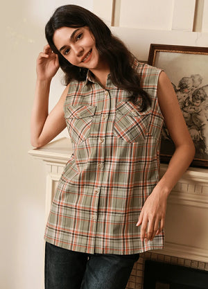 Women in a teal green cozy plaid flannel vest