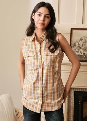 Women in a orange white cotton western pearl snap plaid vest