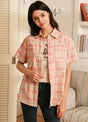 Women in a pink short-sleeve summer shirt with snap button