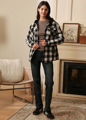 Women in a warm white and black quilted-lined flannel jacket with hood