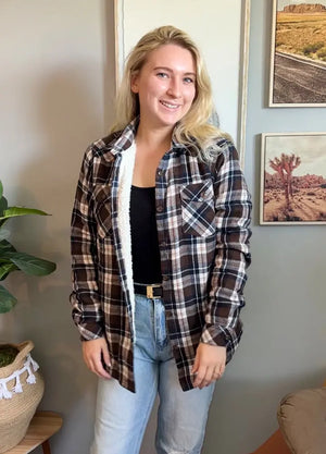 Women wearing a brown white sherpa-lined flannel shirt jacket