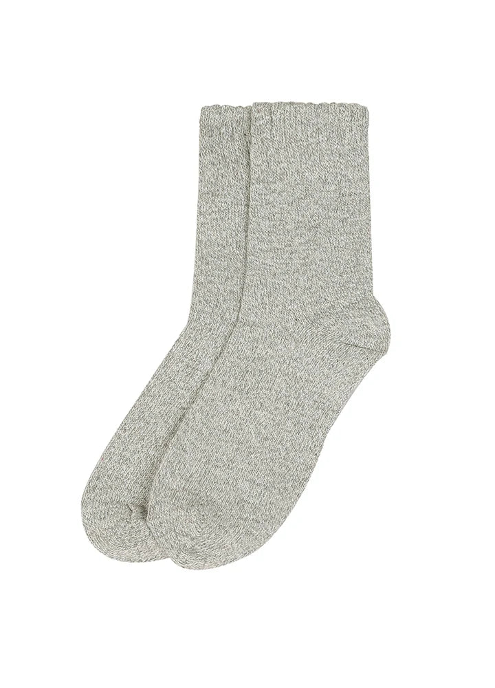 Black socks with white trim on a white background