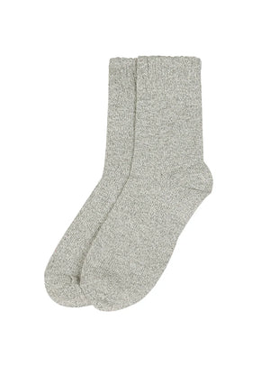 Black socks with white trim on a white background