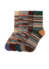Six pairs of patterned crew socks arranged in a fan shape on a plain white background. The socks feature various multicolor Fair Isle and striped patterns in shades of brown, green, blue, orange, beige, and gray.