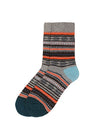 A pair of crew socks with a multicolor Fair Isle pattern featuring gray, black, orange, white, and light blue stripes, with a dark teal toe and heel.