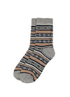 A pair of crew socks with a gray ribbed cuff and toe, featuring a multicolor Fair Isle pattern of black, white, and orange geometric stripes on a white background.