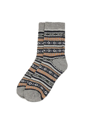 A pair of crew socks with a gray ribbed cuff and toe, featuring a multicolor Fair Isle pattern of black, white, and orange geometric stripes on a white background.