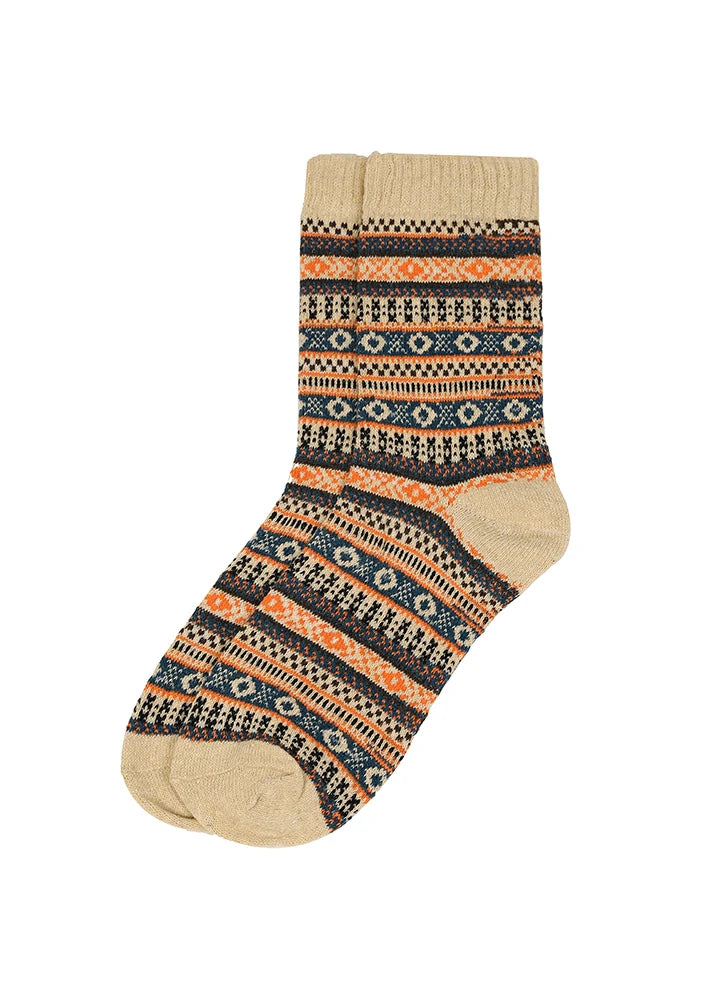 A single crew sock with a multicolor Fair Isle pattern on a solid white background.