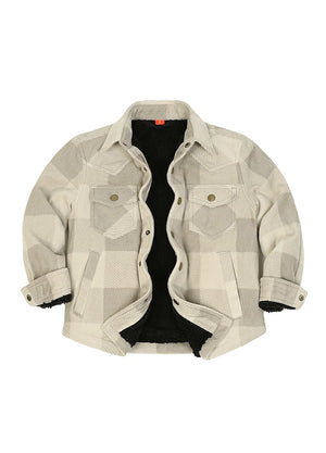 A cropped button-up shirt jacket featuring a beige and gray geometric plaid pattern, a black sherpa lining, and buttoned chest pockets, displayed flat against a white background.