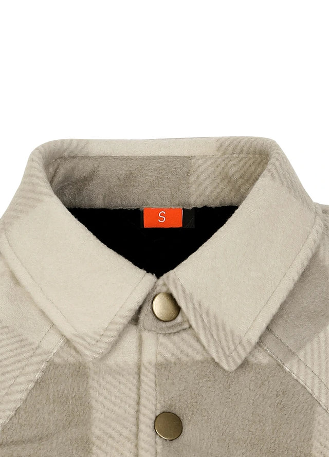 Close-up of a beige and gray herringbone patterned jacket with a pointed collar, gold-tone buttons, and a black inner lining featuring an orange size label marked 'S'.