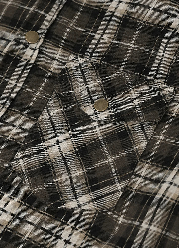 Close-up of a plaid button-up shirt fabric in black, white, and gray with two visible metal buttons-XR1302KAF-S,XR1302KAF-M,XR1302KAF-L,XR1302KAF-XL,XR1302KAF-XXL