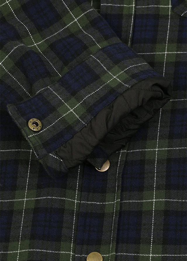 Close-up of a plaid button-front garment, likely a jacket or overshirt, with a dark navy and green tartan pattern, white grid lines, and a black quilted lining visible at the cuff-XR1302SGLL-S,XR1302SGLL-M,XR1302SGLL-L,XR1302SGLL-XL,XR1302SGLL-XXL