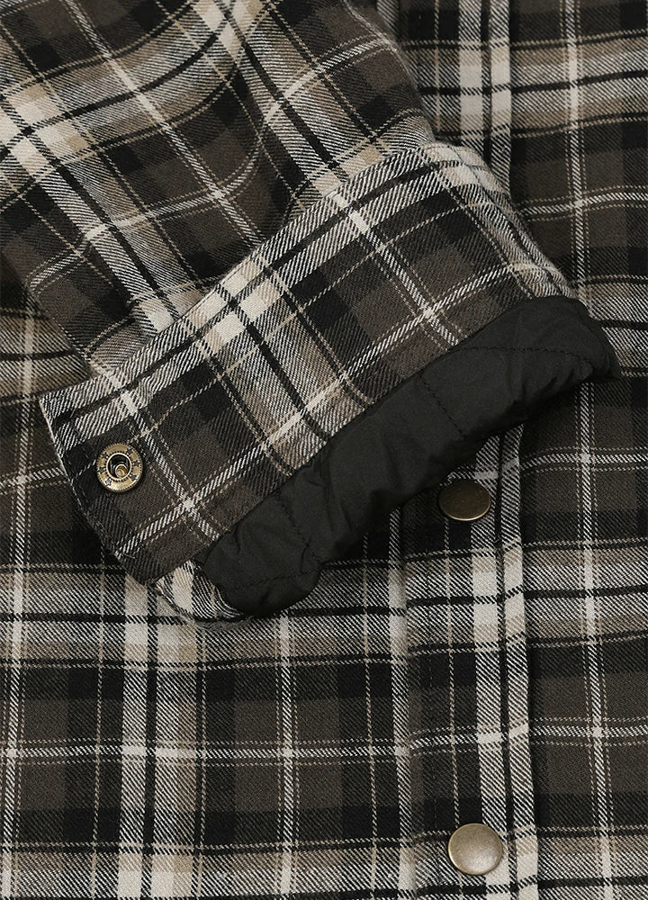 Close-up of a plaid button-up shirt with a black quilted lining visible inside the turned-up cuff, featuring dark brown, black, and off-white check pattern and metal buttons-XR1302KAF-S,XR1302KAF-M,XR1302KAF-L,XR1302KAF-XL,XR1302KAF-XXL