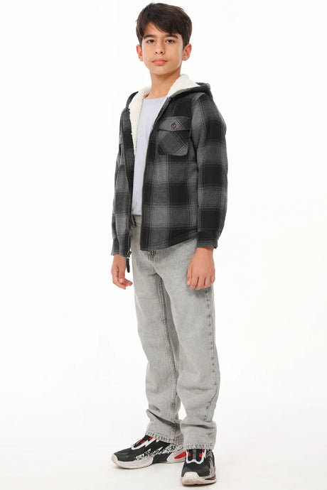 A boy who wears a sherpa lined flannel jacket