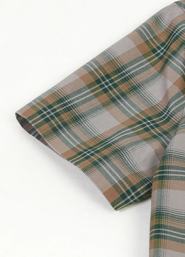 Detail of kids green gray short sleeve shirt with hemmed cuff