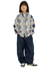A handsome boy in country meadow pathwork flannel shirt