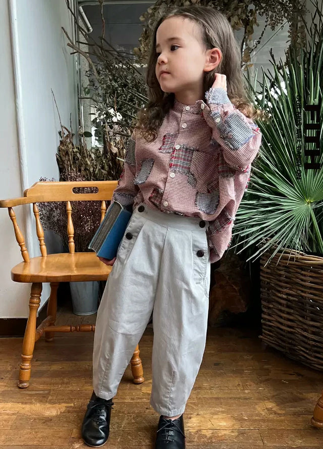 A girl in pink toddler plaid patchwork flannel shirt 