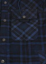 Close-up of the pocket of indigo men's cotton flannel shacket with hood