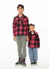 Brother and sister in pink flannel shackets